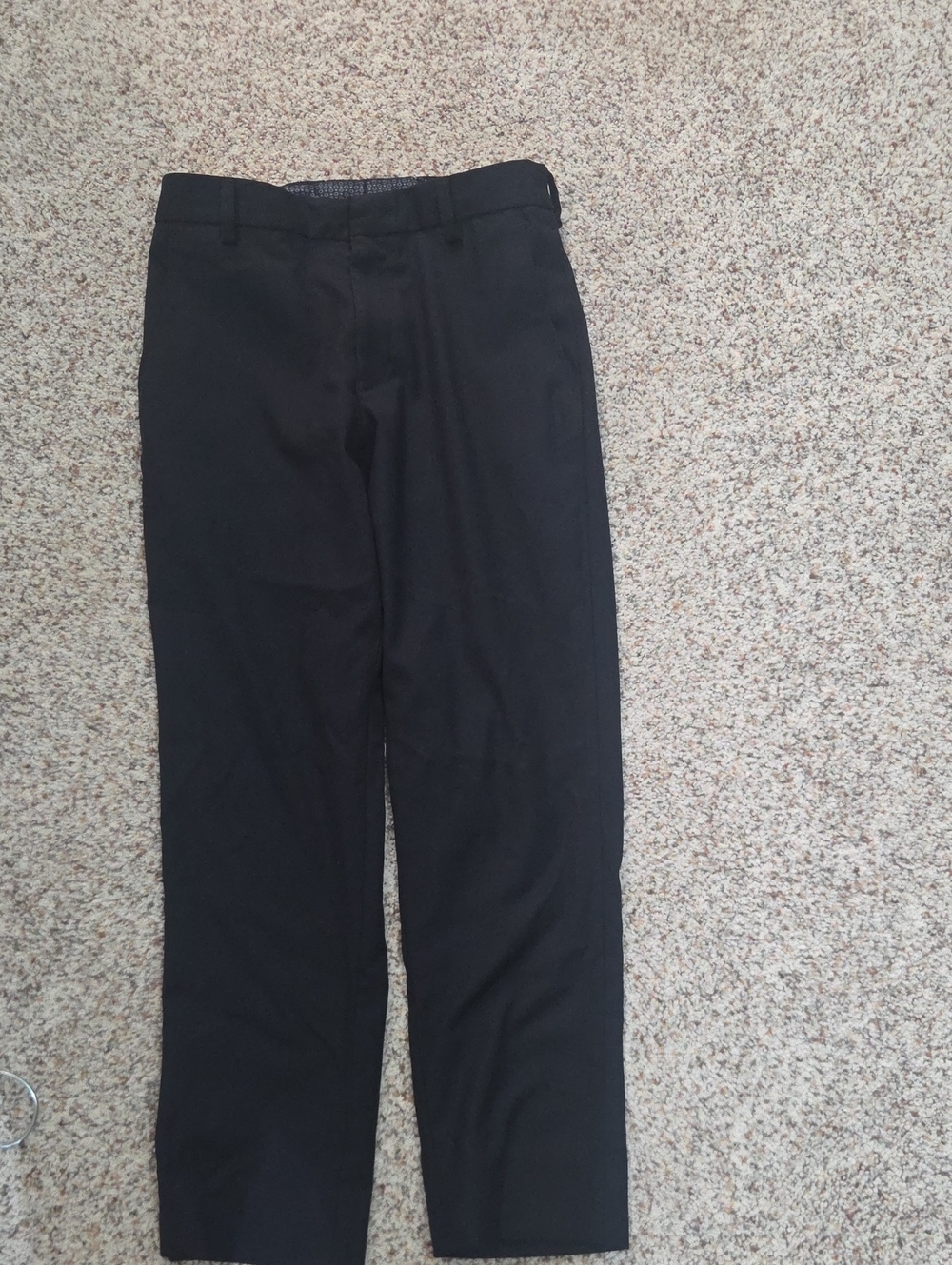 A pair of kids straight-fit dress pants with a classic flat- front desig.